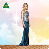 Woman in a blue evening gown standing on a wooden deck with a colorful sky background, Australian Made logo visible.